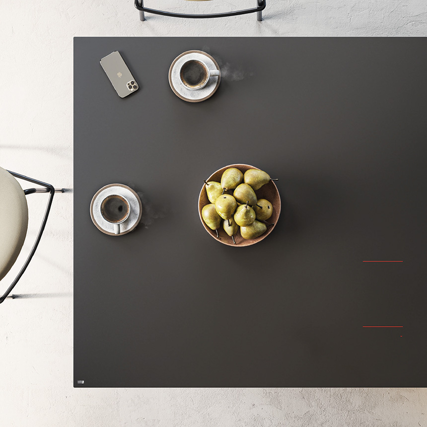 Encimera con sistema de cocción integrado y carga inalámbrica para smartphone